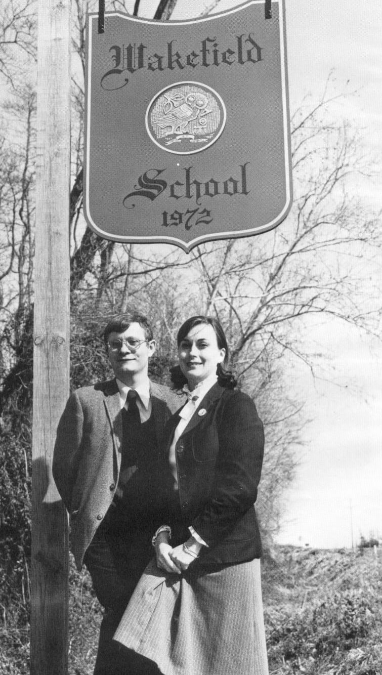 Wakefield founders posing with school sign
