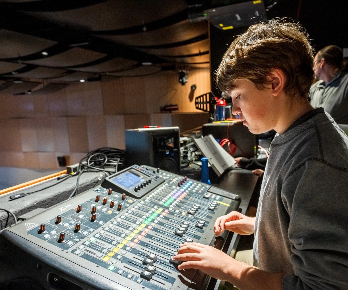 student using the theater sound and light board