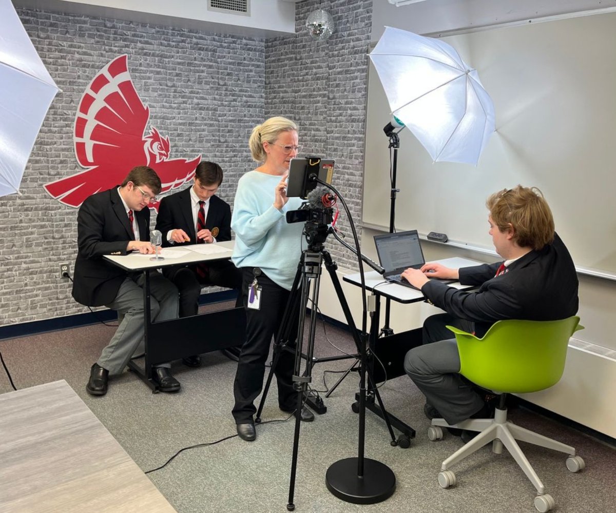 students preparing to record school news video