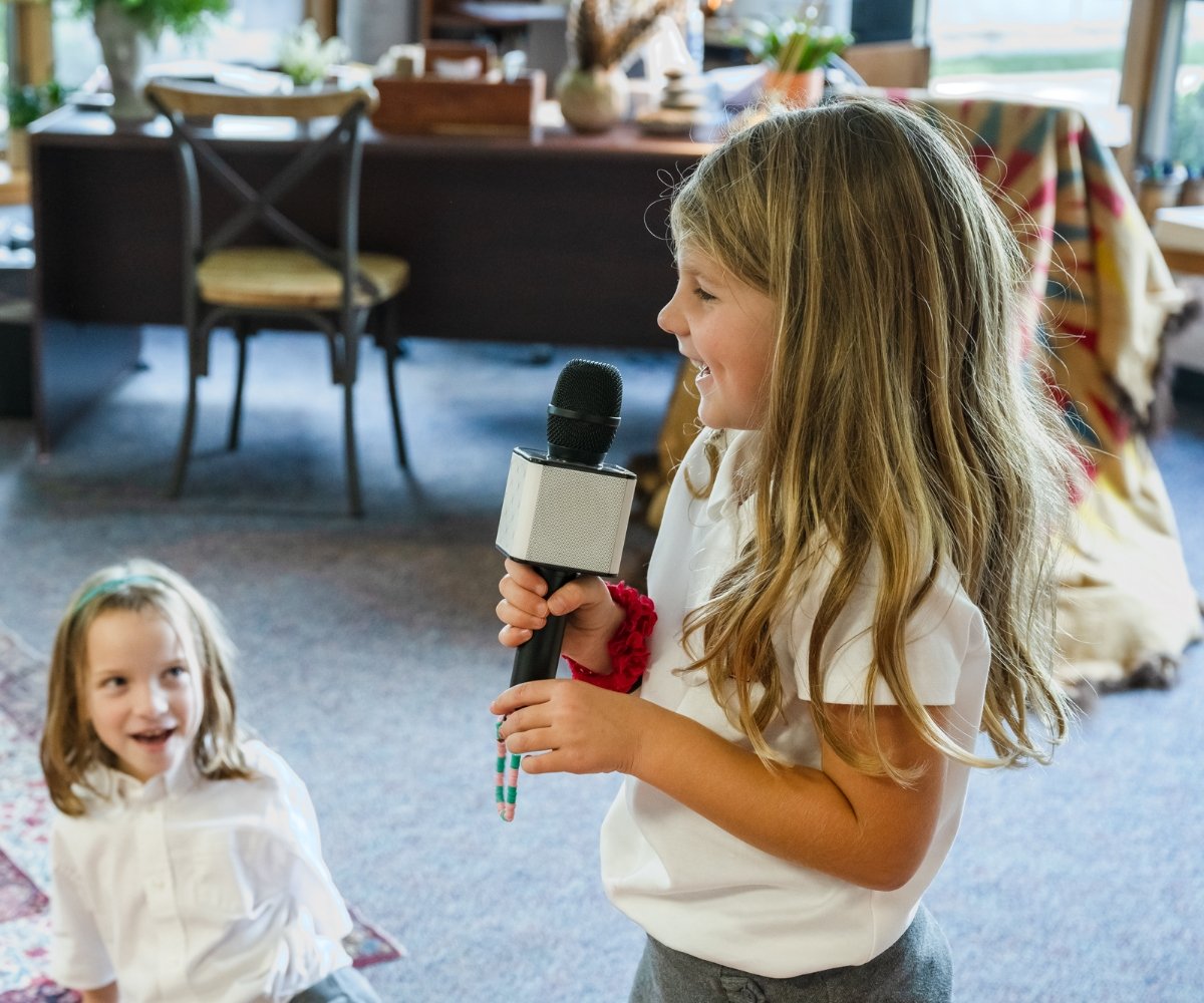 student singing into a microphone
