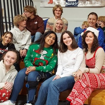 Class of 2022 seniors wearing holiday sweaters