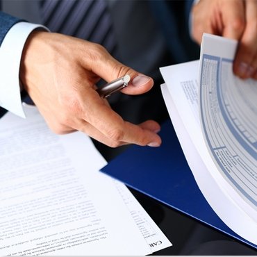 hands holding professional documents