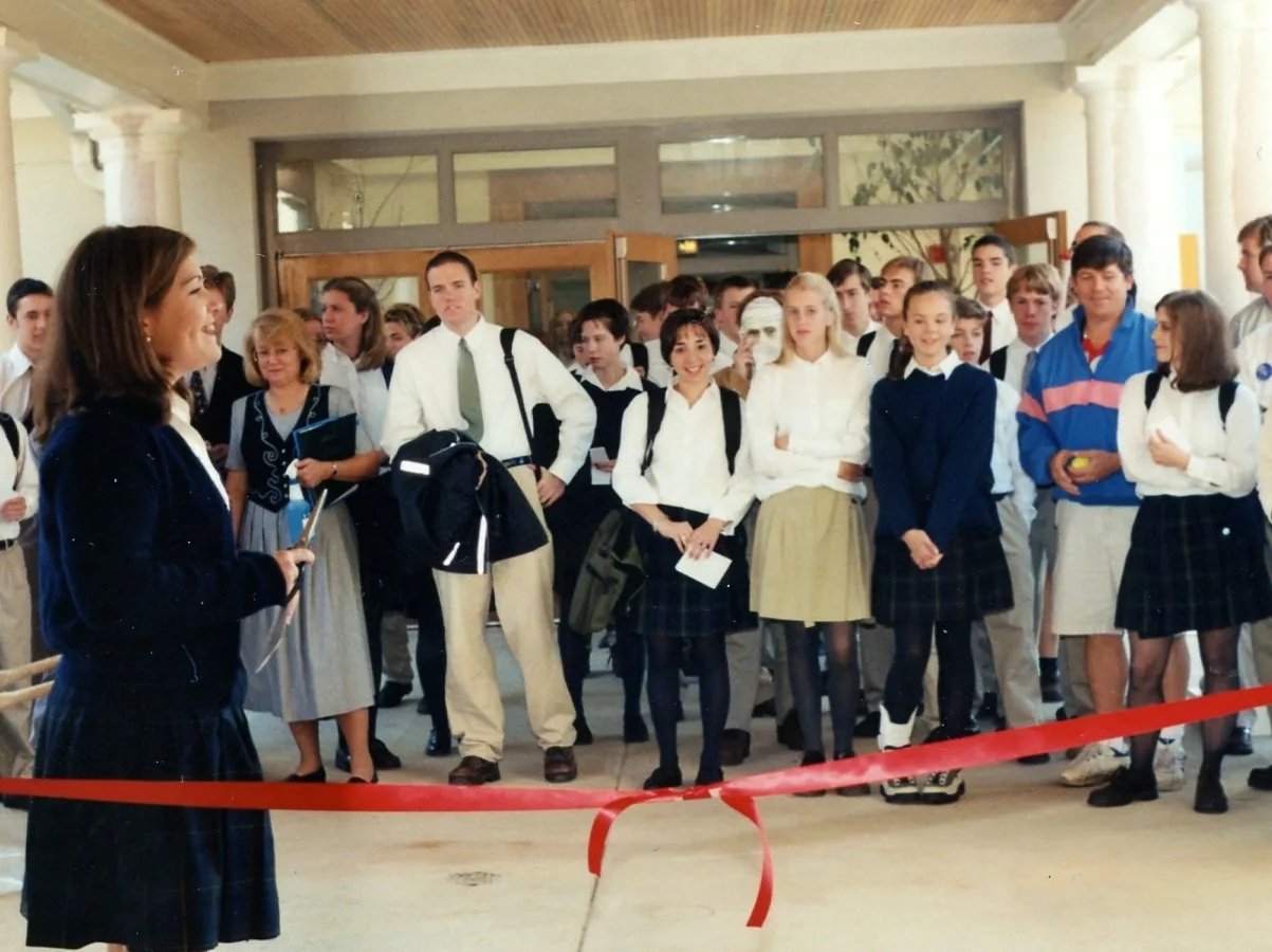 students grouped together at a ribbon cutting ceremony