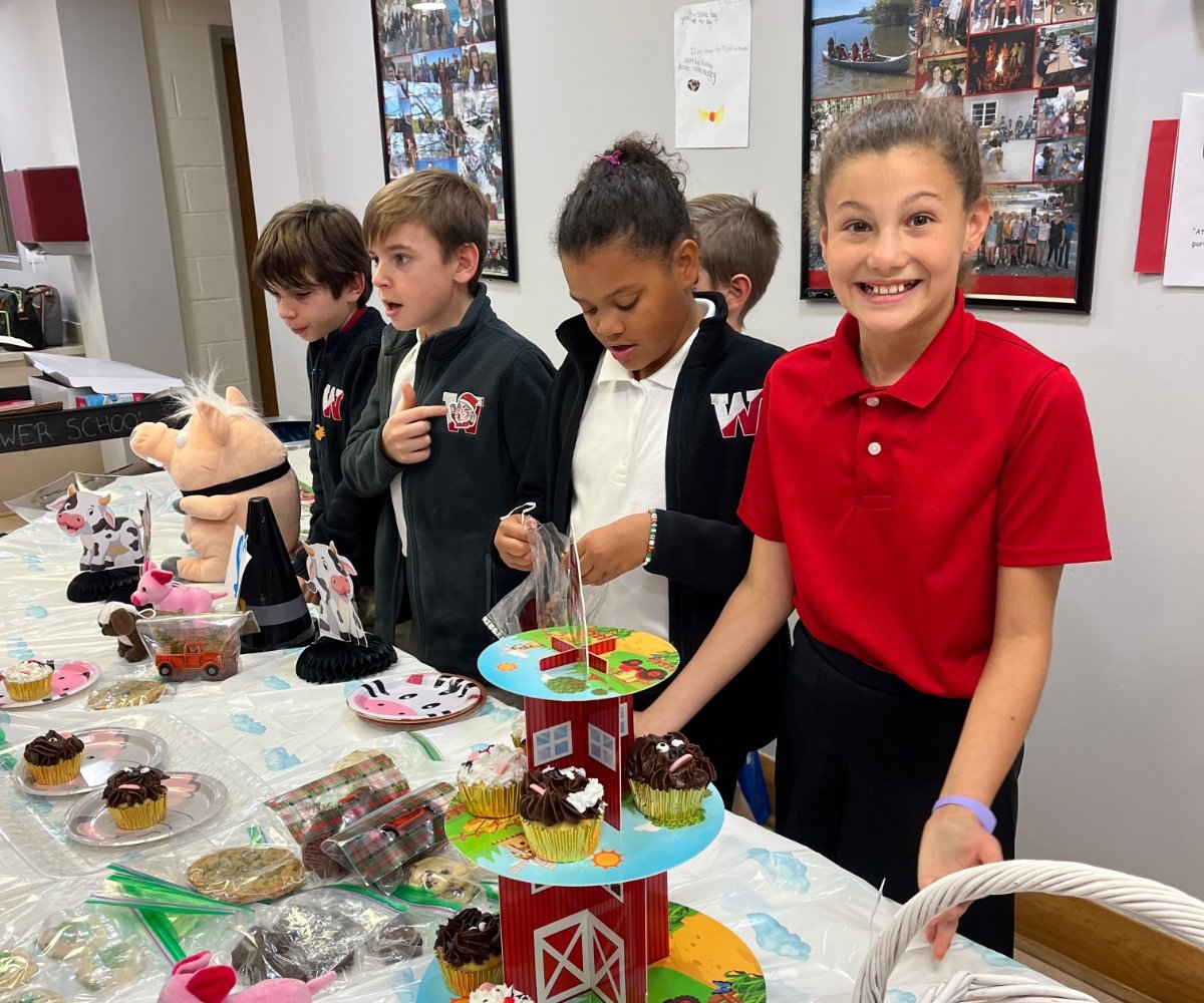 lower school students running a bake sale