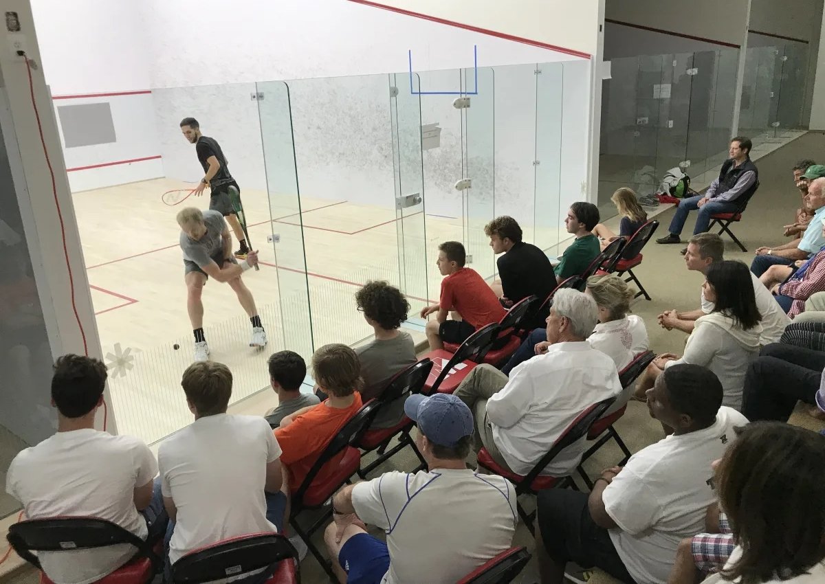 squash match with onlookers seated